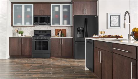 what color cabinets go with black stainless steel appliances|brown kitchen cabinets black appliances.